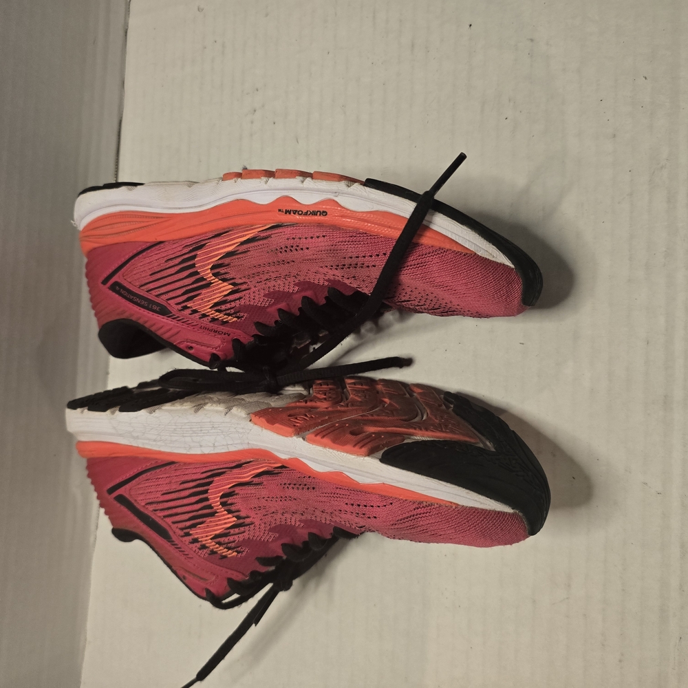 Vibrant Pink and Orange Athletic Shoes with‎ Cushioned Midsole and Sleek Design